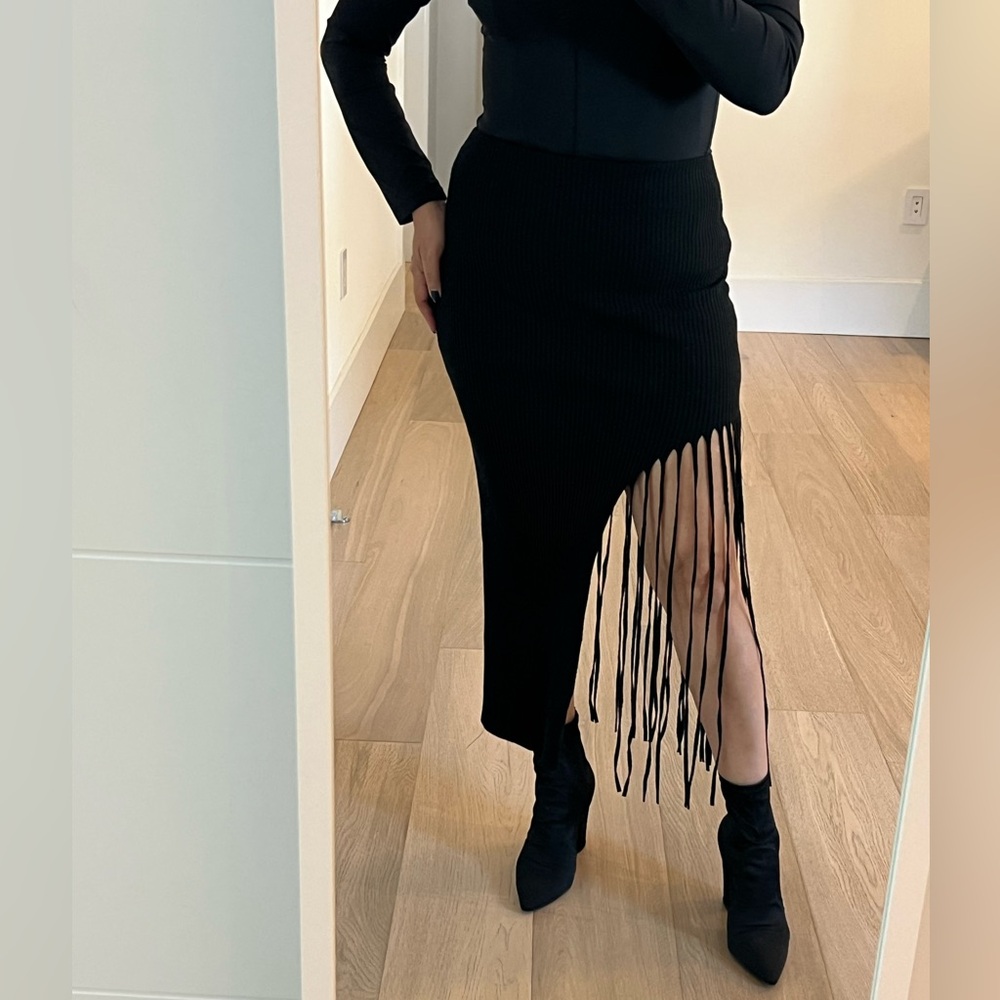 Zara black midi skirt. Fringes on one side. Super fun.